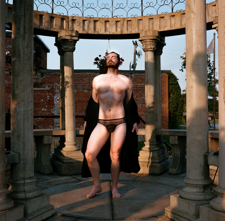 Model: Tristan Ginger, Photo: Les Huard - Robed model disrobing